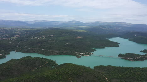 panoramic-aerial-shot-of-lake-Saint-Cassien-mountains-in-background-France